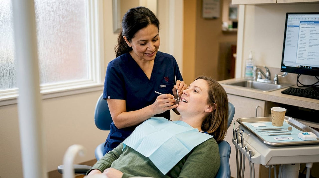 Dentist examining a patient's teeth for biofilm