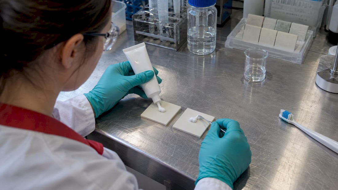 Laboratory toothpaste comparison beside enamel samples