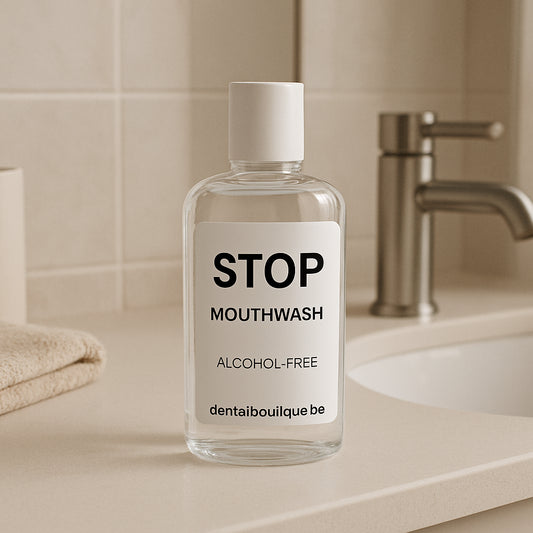 A calm bathroom setting with a sleek bottle of STOP Mouthwash on the counter. Alt: Alcohol‑free mouthwash bottle on a bathroom shelf.