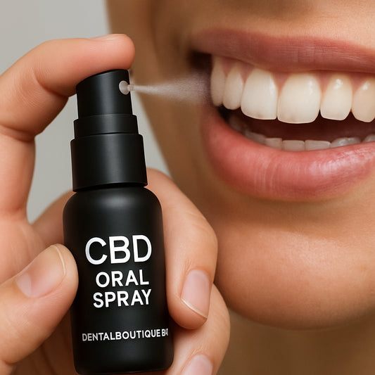 A close‑up of a hand holding a sleek CBD oral spray bottle, mist hovering over a smiling gum line. Alt: CBD oral spray delivering soothing mist to gums.
