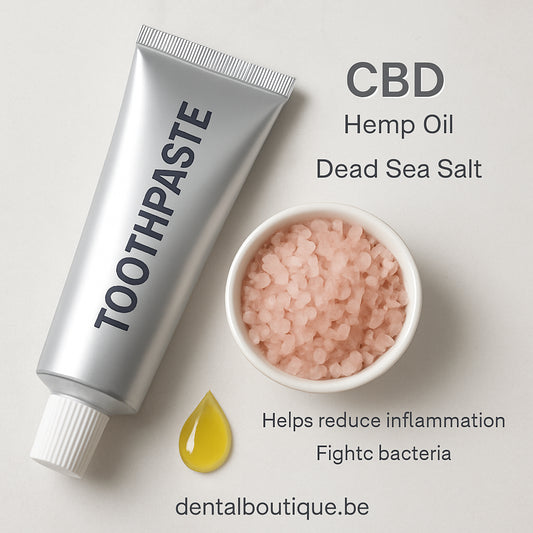 A close‑up of a sleek toothpaste tube next to a small bowl of pink Dead Sea salt crystals, with a drop of hemp oil glistening on the side. Alt: CBD toothpaste ingredients and benefits illustration.